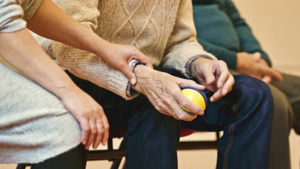 elderly man and caregiver